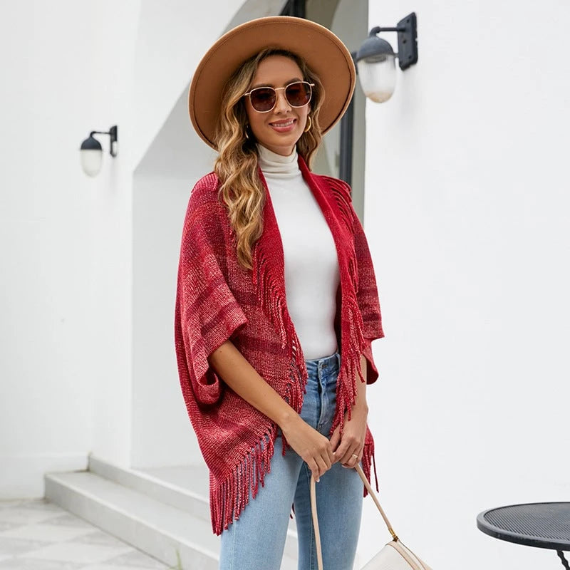Women’s fashionable knitted poncho with casual fringe design and elegant structure