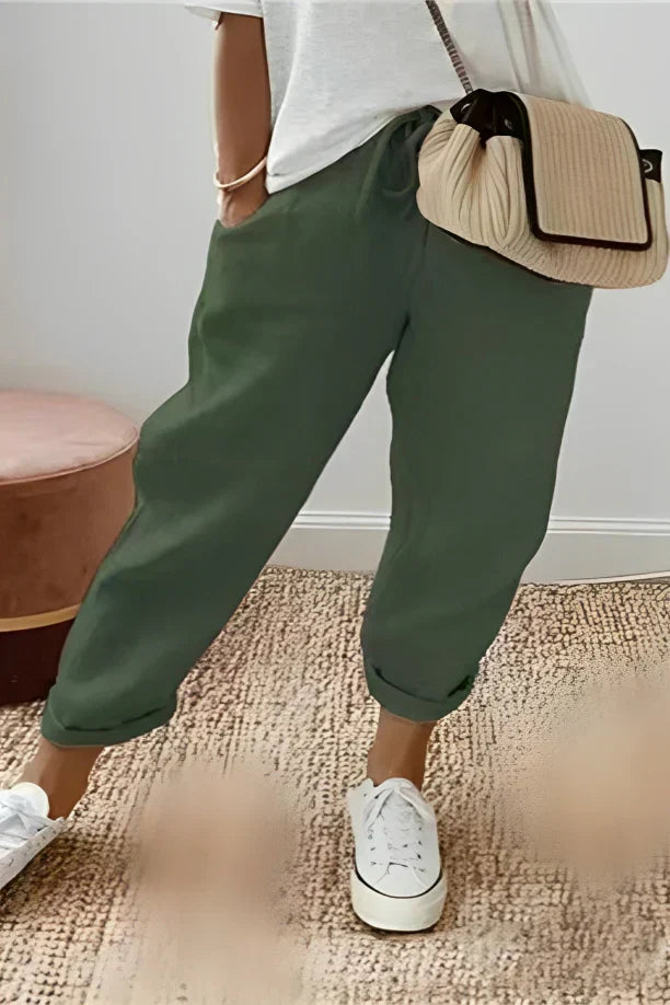 Pants with drawstring and diagonal pocket