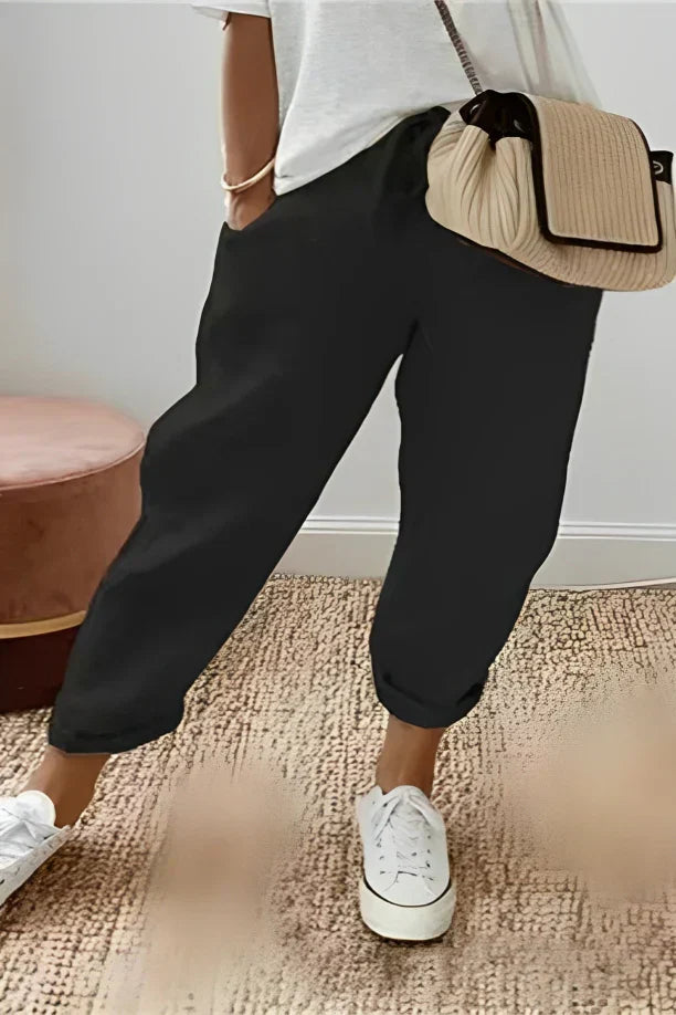 Pants with drawstring and diagonal pocket