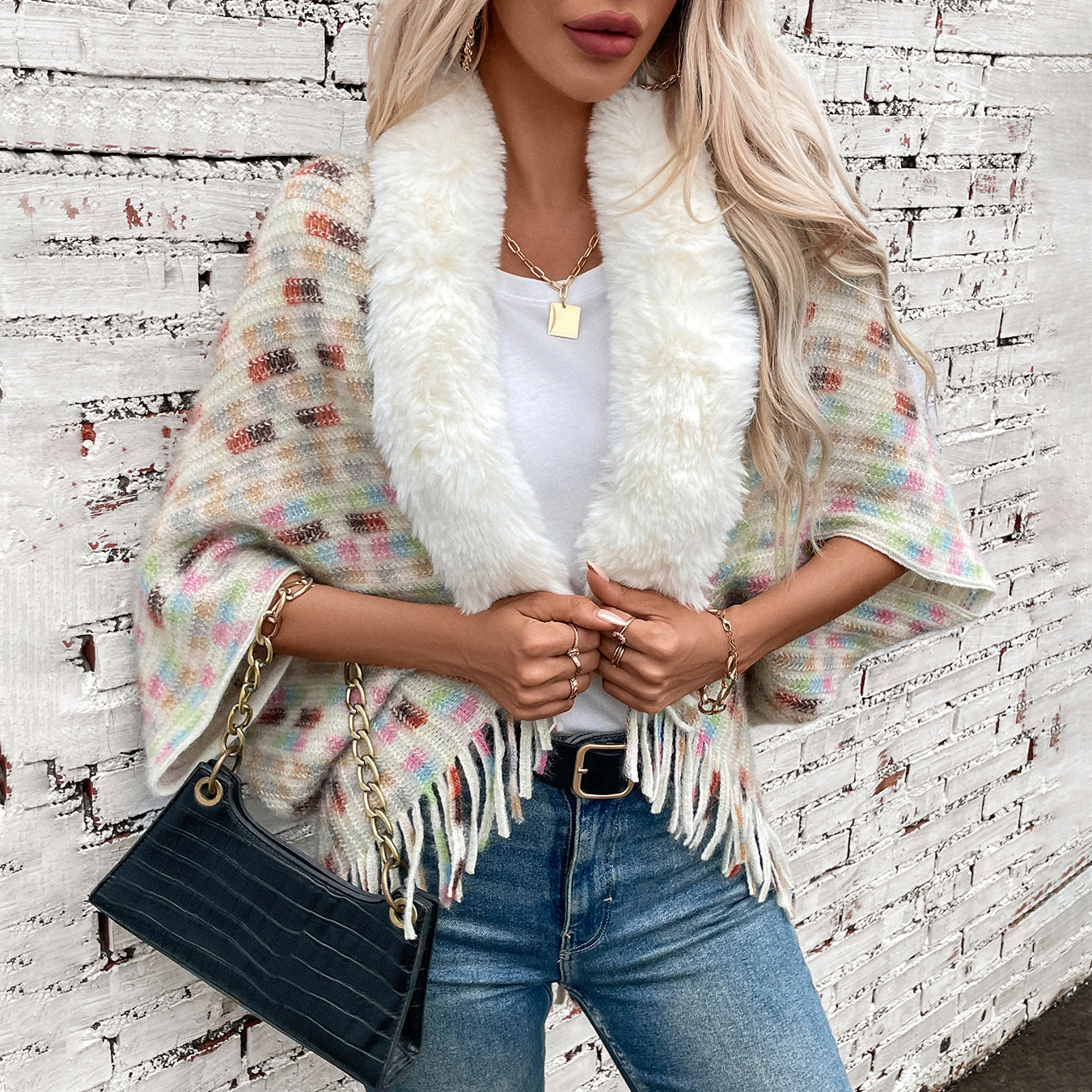 Ladies elegant poncho with luxurious faux fur collar and fringes