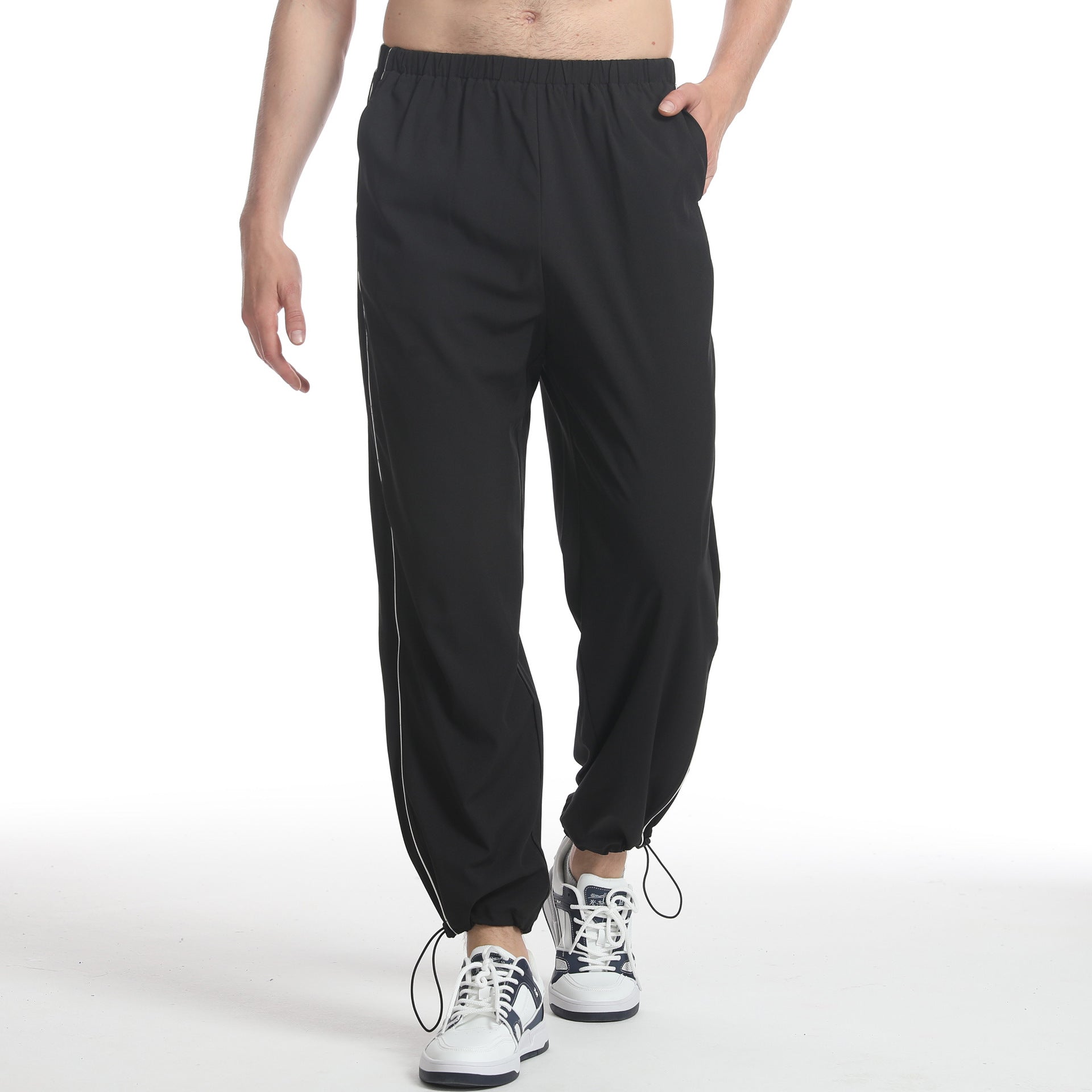 Men's sporty jogging pants with elastic waistband and side zippers