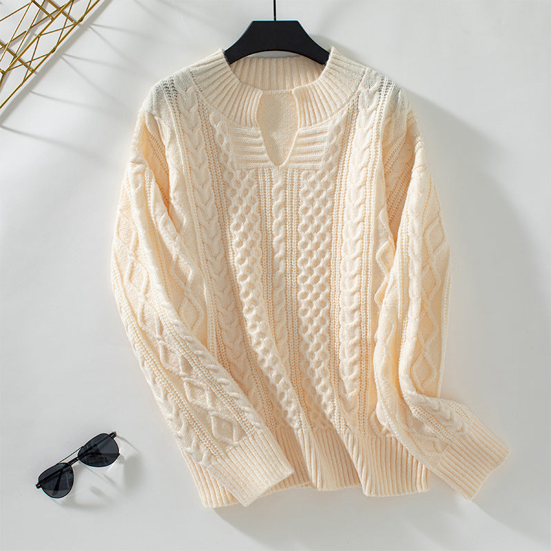 Ladies fashionable knit pullover with unique cable design and round neckline