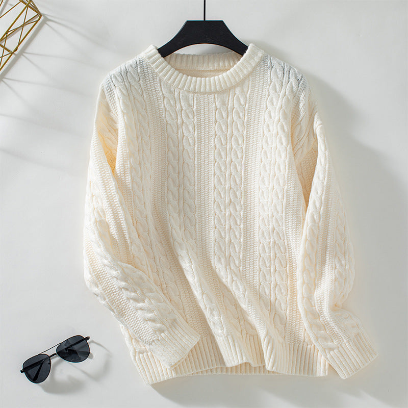 Women's knitted pullover with cable pattern and high cuffs