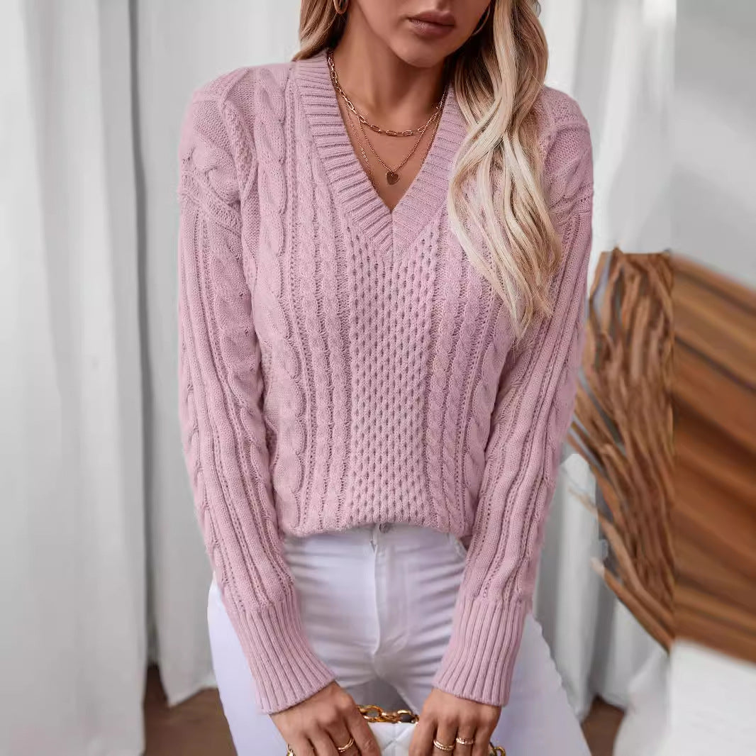 Women's fashionable knitted pullover with deep V-neck and cable pattern