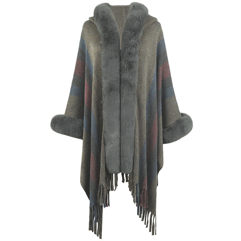 Ladies fashionable poncho with luxurious faux fur collar and fringes