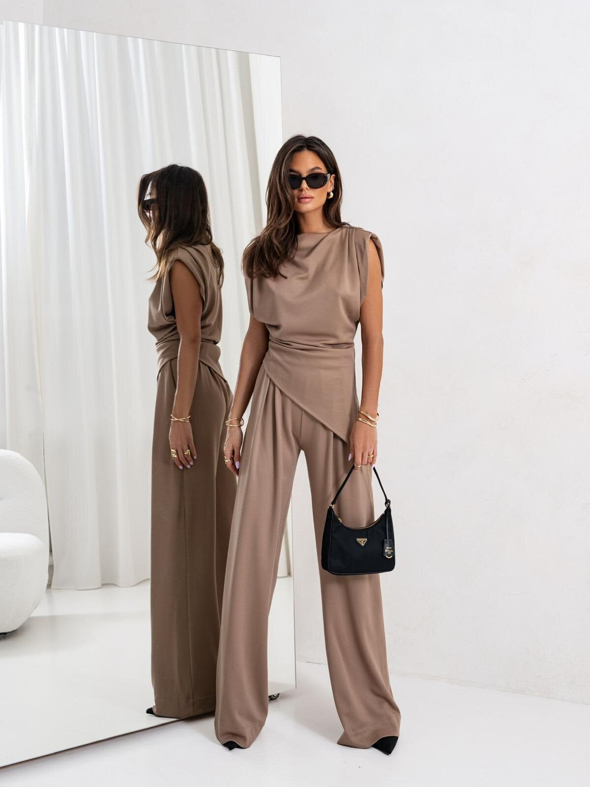 Women's elegantly cut jumpsuit with asymmetric design and wide leg