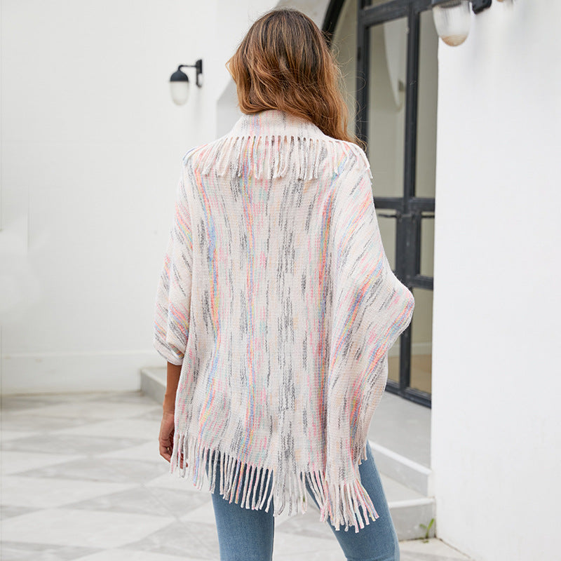 Women's knit poncho with luxurious fringes and modern design
