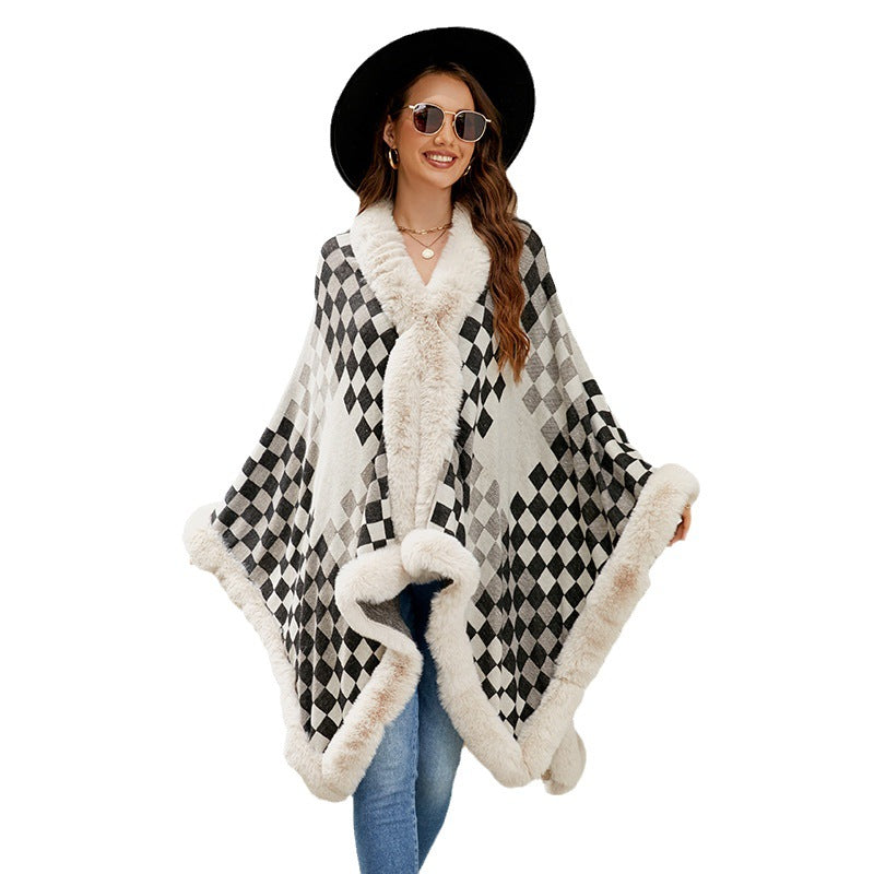 Ladies elegant knitted poncho with luxurious faux fur trim and geometric pattern