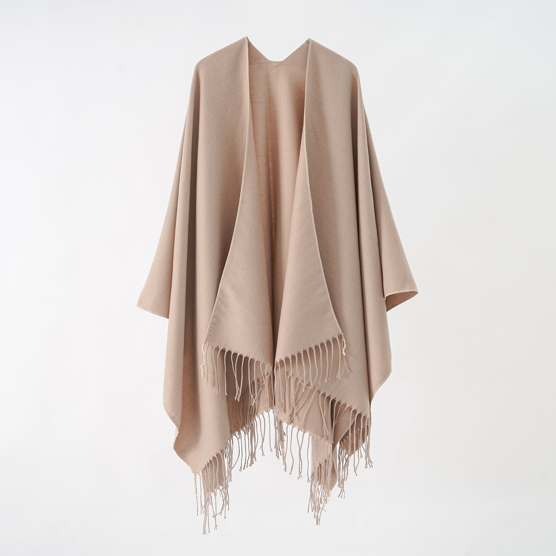 Women's stylish fringe poncho made from soft material with a luxurious drape