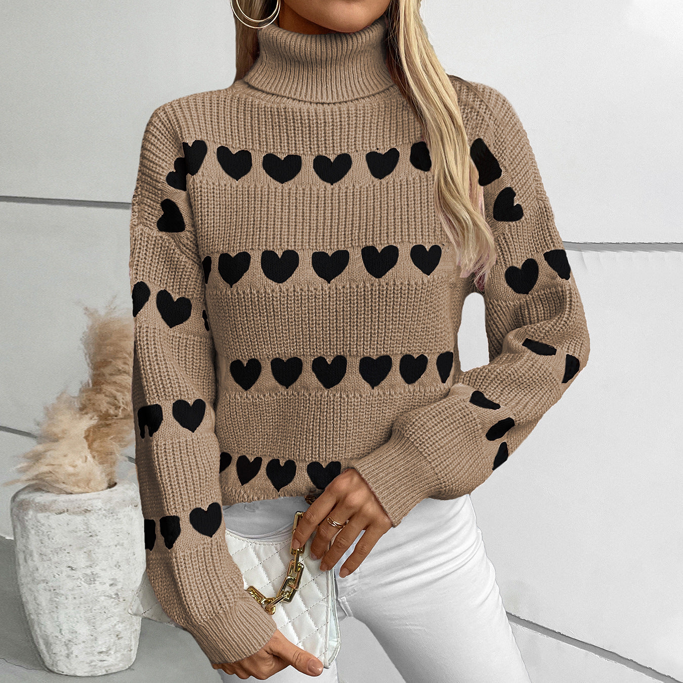 Women's knitted pullover with heart pattern and high collar