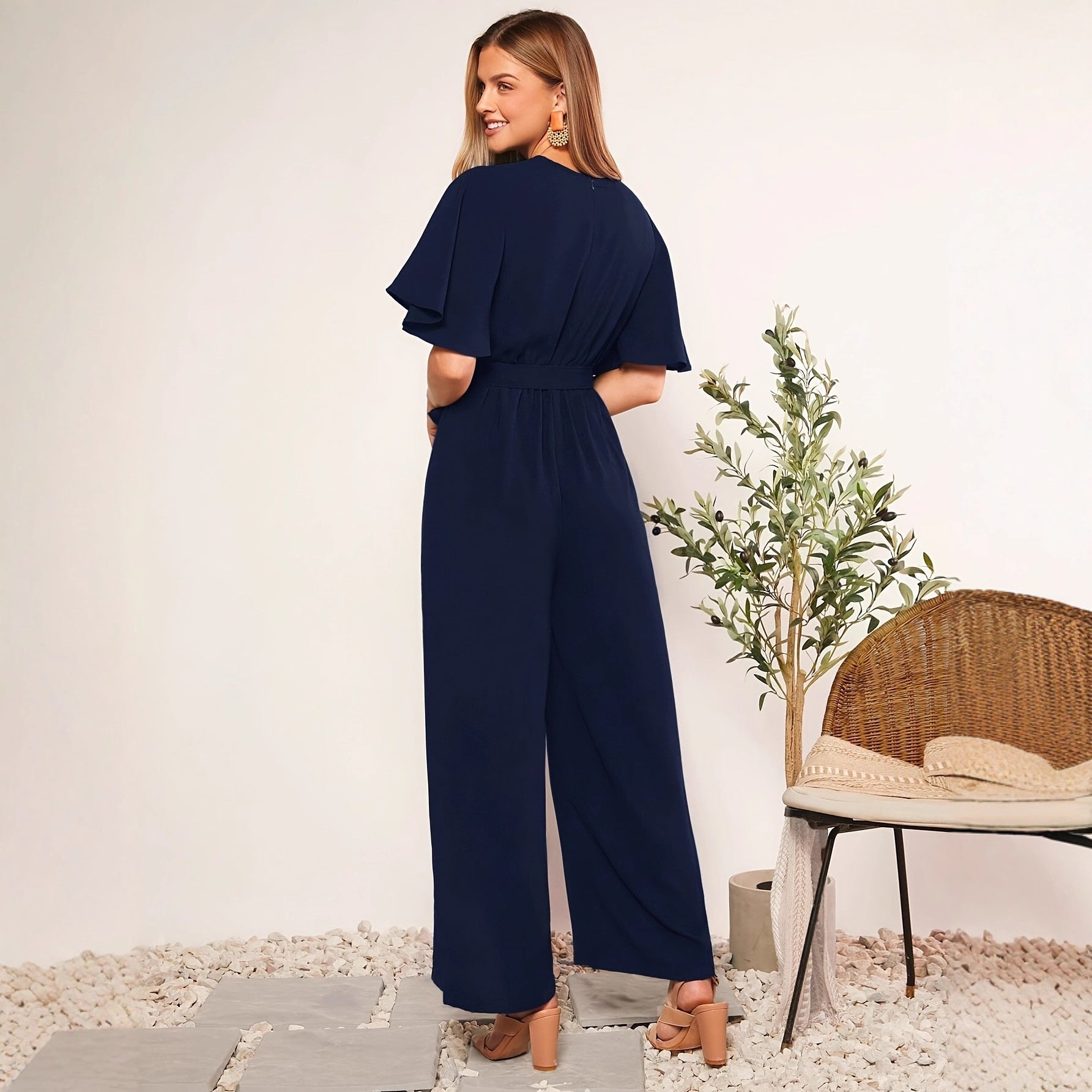 Ladies elegant jumpsuit with deep V-neck and poncho sleeves