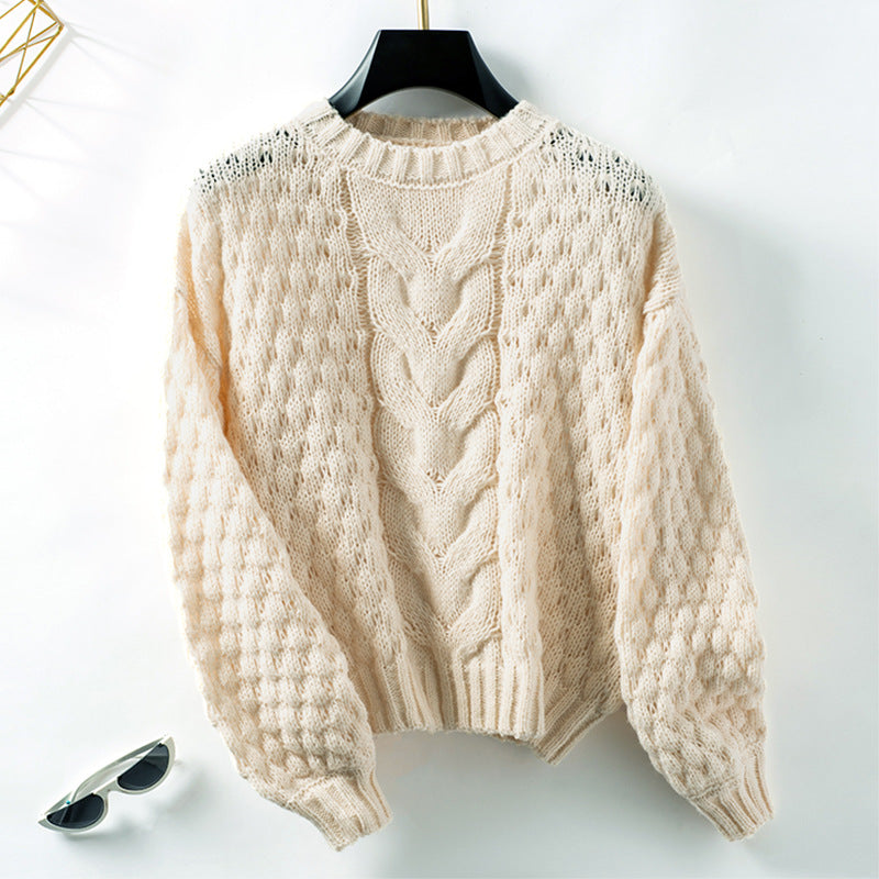 Women's cozy knit pullover with textured cable pattern and casual fit