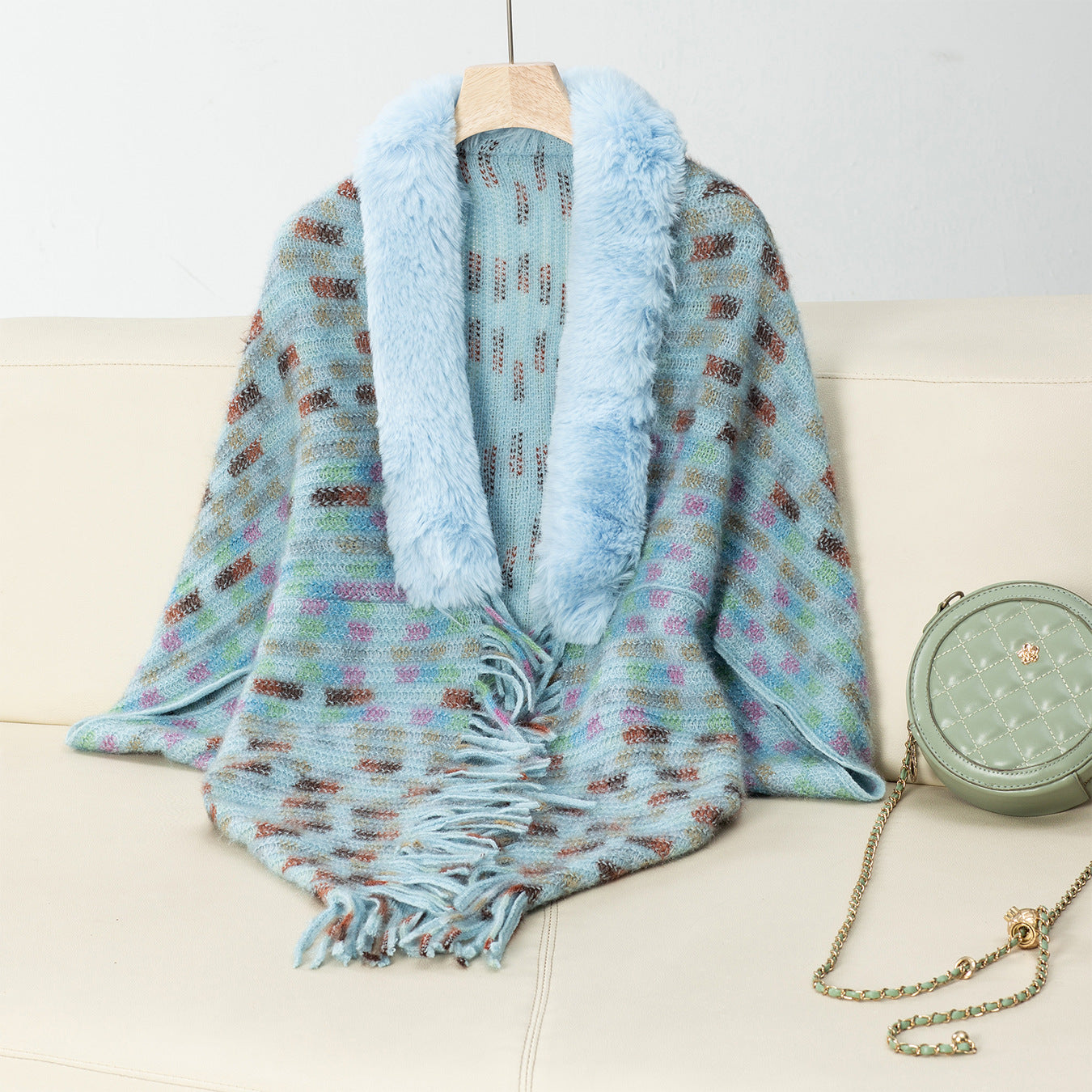 Ladies elegant poncho with luxurious faux fur collar and fringes