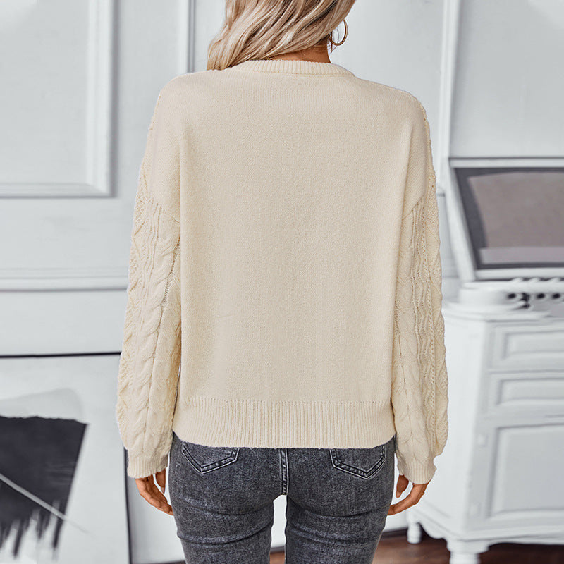 Women's chunky knit pullover with textured cable pattern