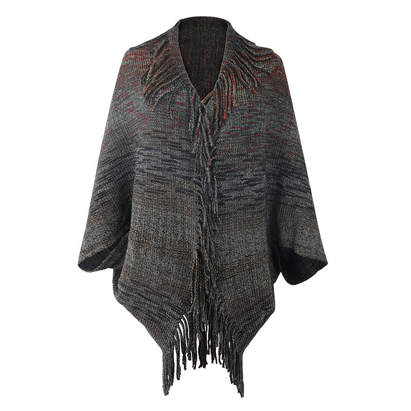 Ladies fashionable poncho with fringed hem and textured design