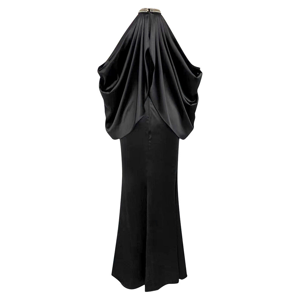 Ladies evening dress with shimmering cape design and elegant closure detail