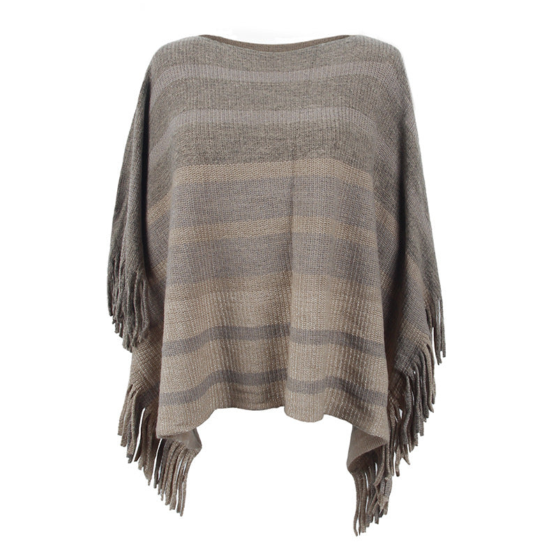 Ladies elegant poncho with textured design and fringed details