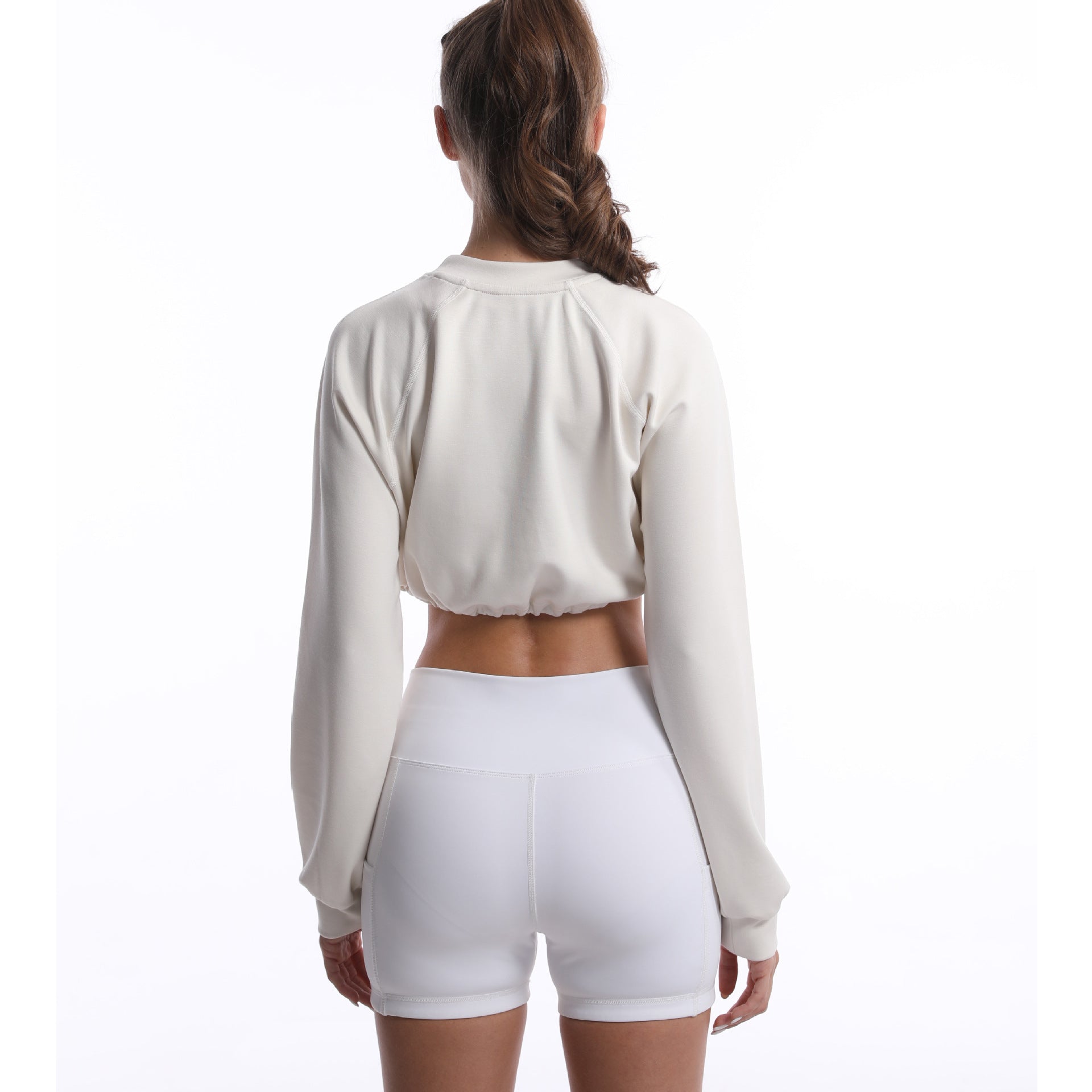 Women's sporty crop pullover with adjustable hem and long sleeves