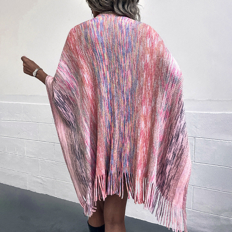 Ladies fashionable poncho with luxurious faux fur trim and creative fringes
