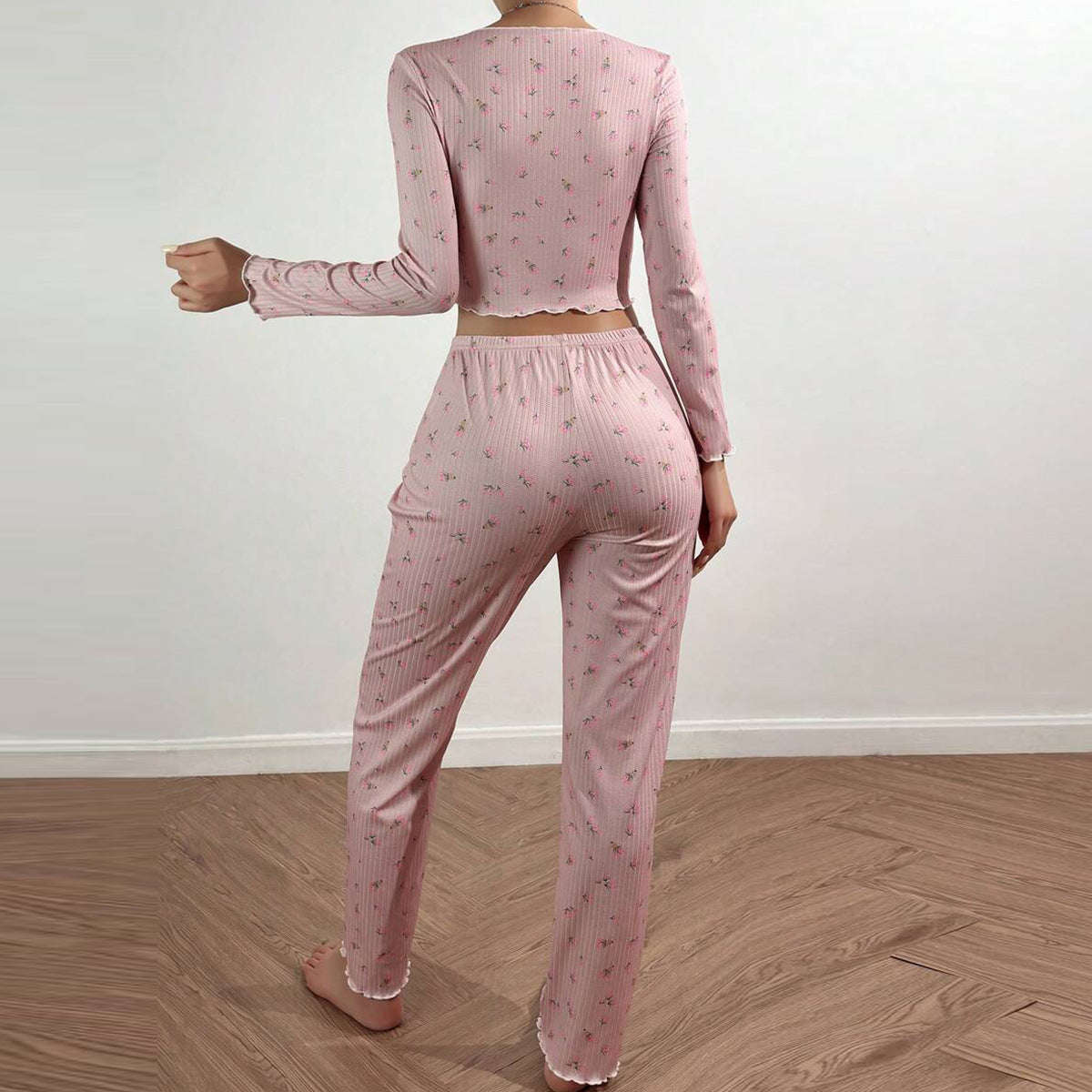 Women's pajama set with delicate ruffle and floral pattern