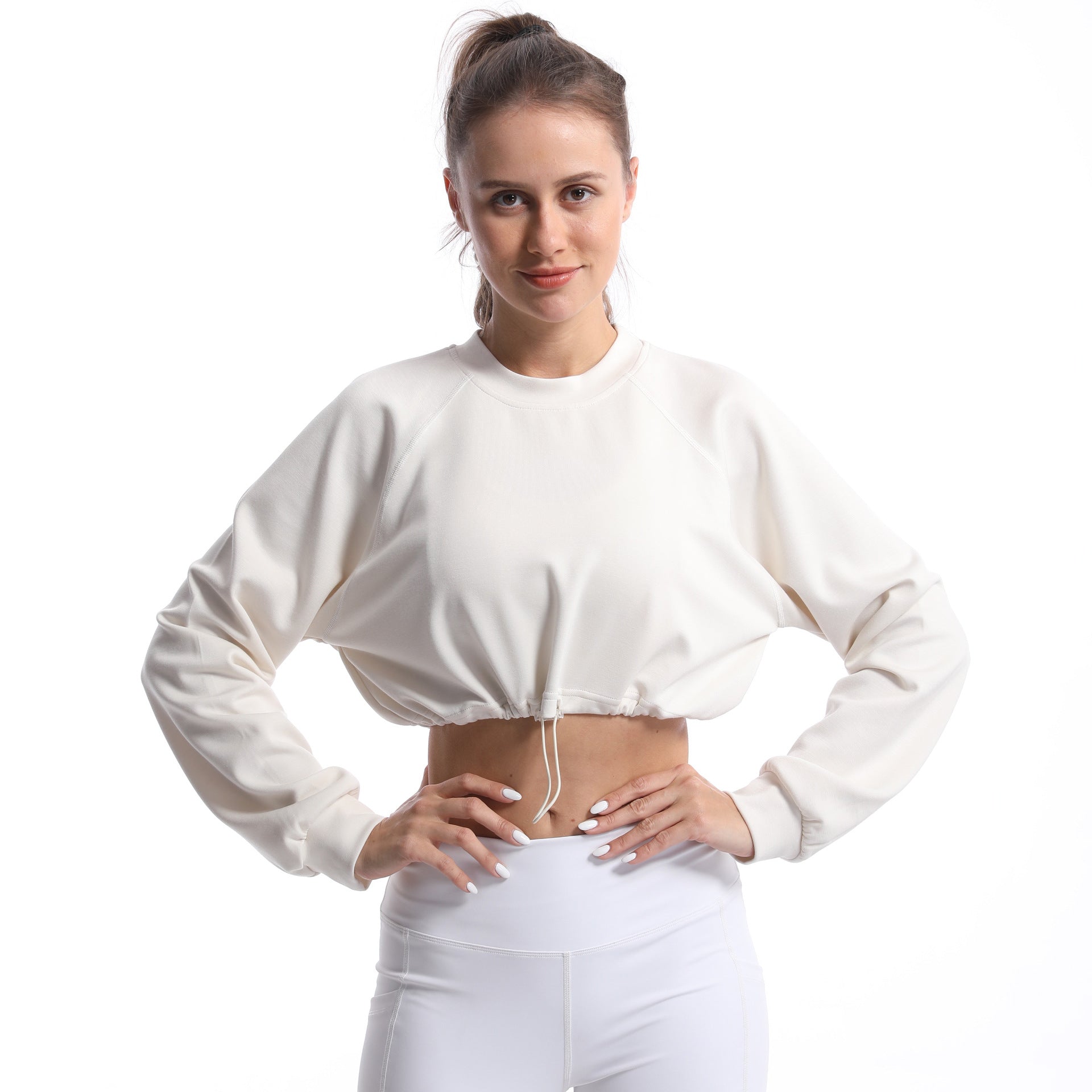 Women's sporty crop pullover with adjustable hem and long sleeves