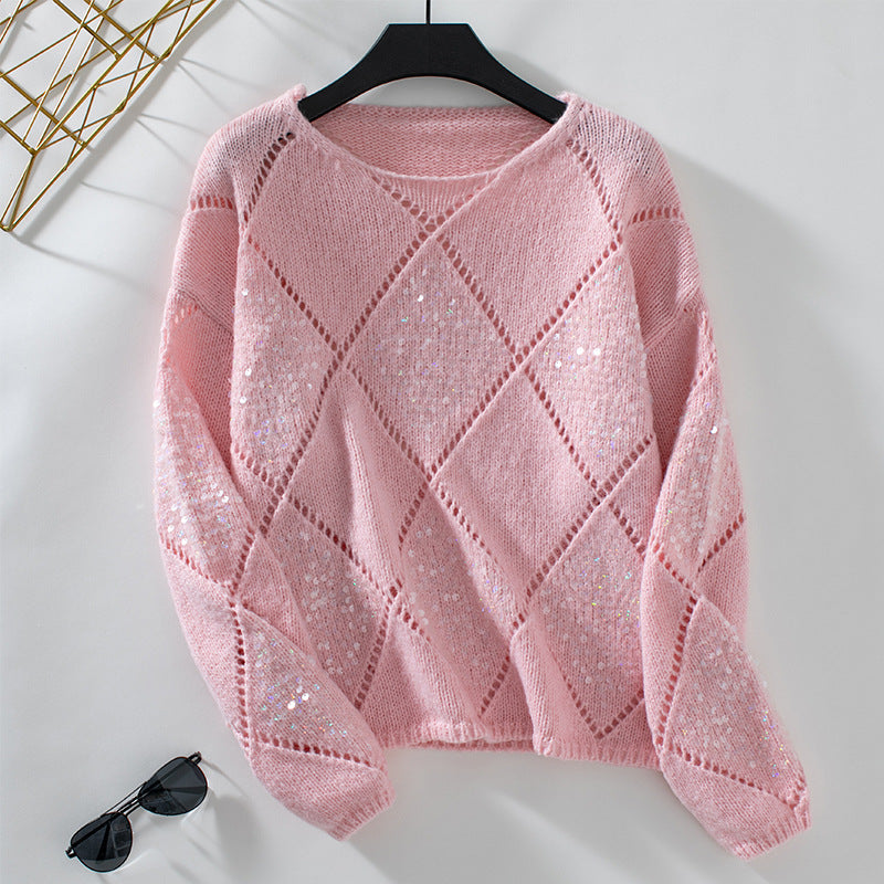 Ladies fashionable pullover with intricate knit design and glitter elements