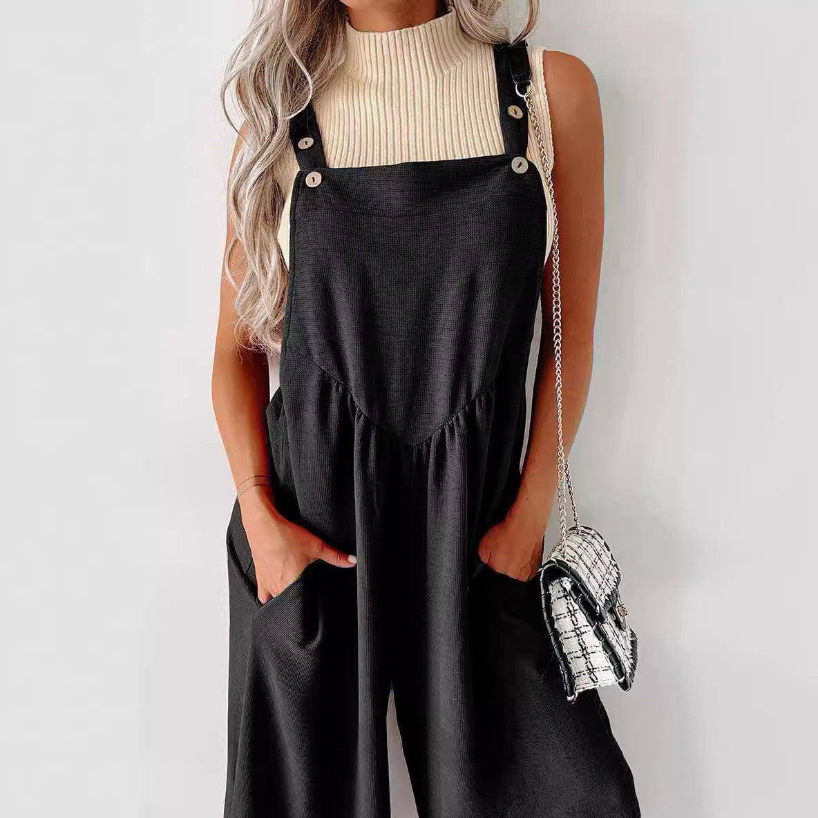 Women’s casual jumpsuit with wide cut legs and decorative button details