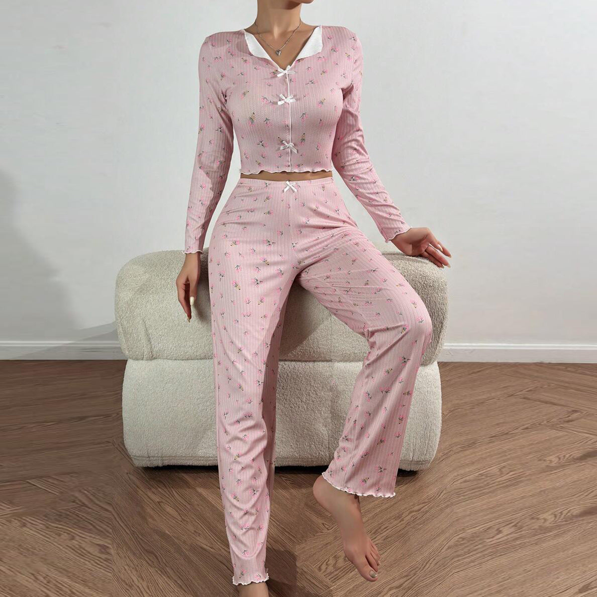 Women's pajama set with delicate ruffle and floral pattern