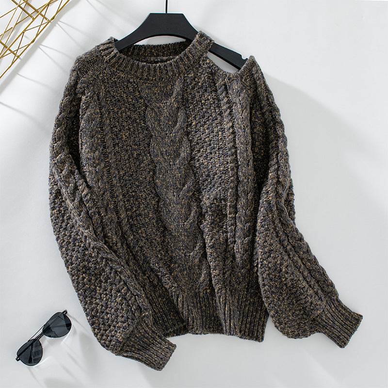 Women's chunky knit pullover with elegant structure and trendy puff sleeves