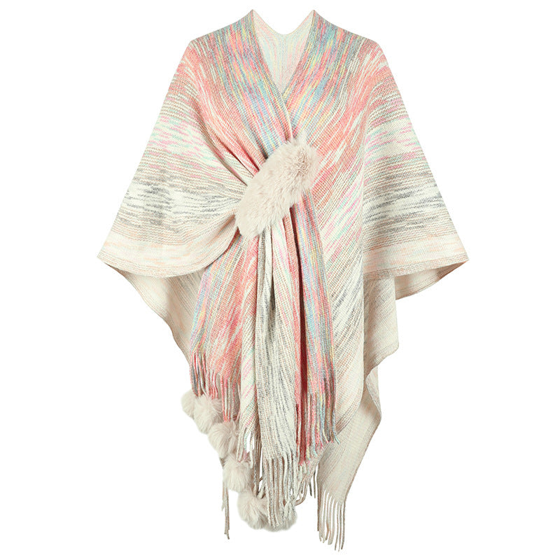 Ladies fashionable poncho with luxurious faux fur trim and creative fringes
