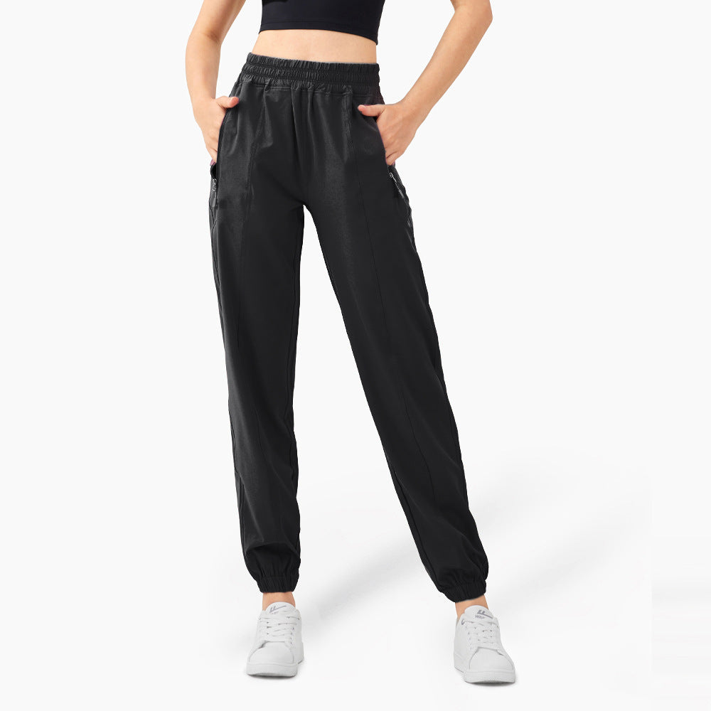 Ladies sporty jogging pants with elastic waistband and side zip pockets