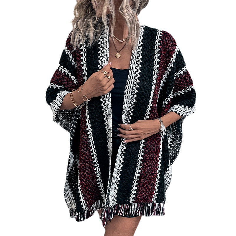 Women's knit poncho with V-neck and fringes
