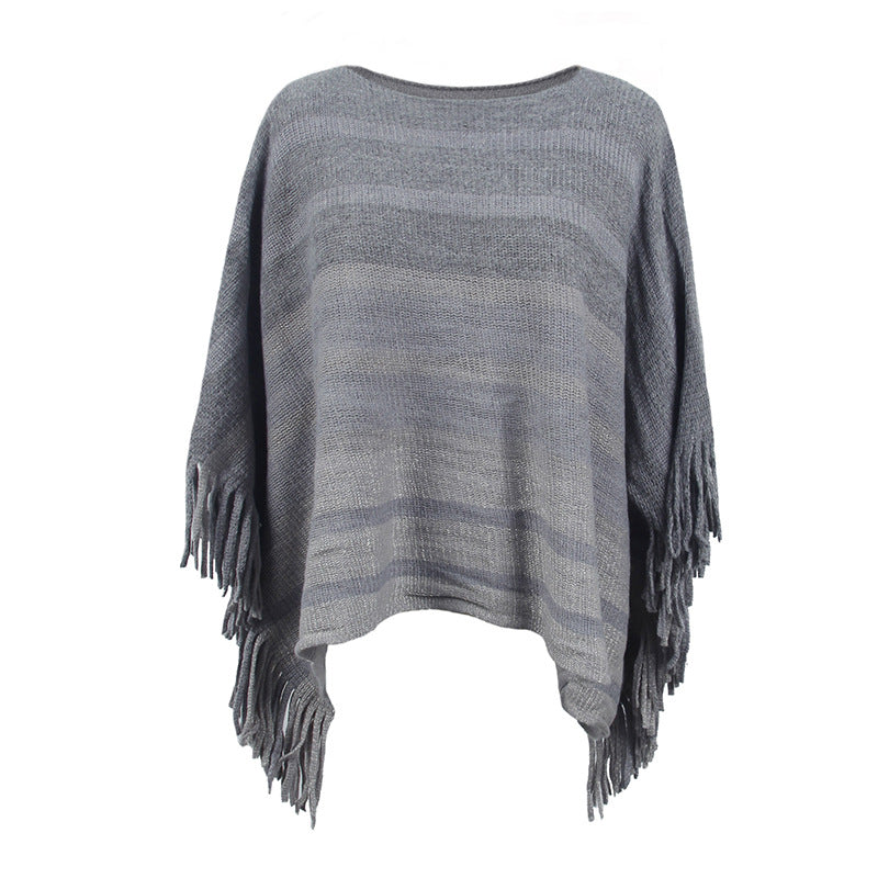 Ladies elegant poncho with textured design and fringed details