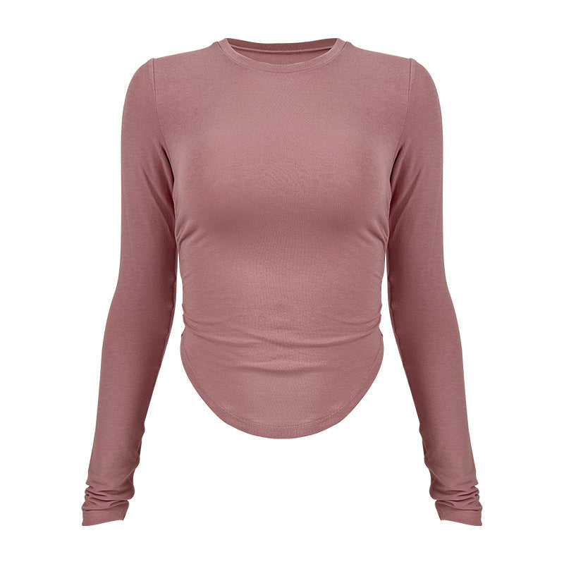 Ladies long-sleeved functional top with stylish gathering elements and figure-hugging cut