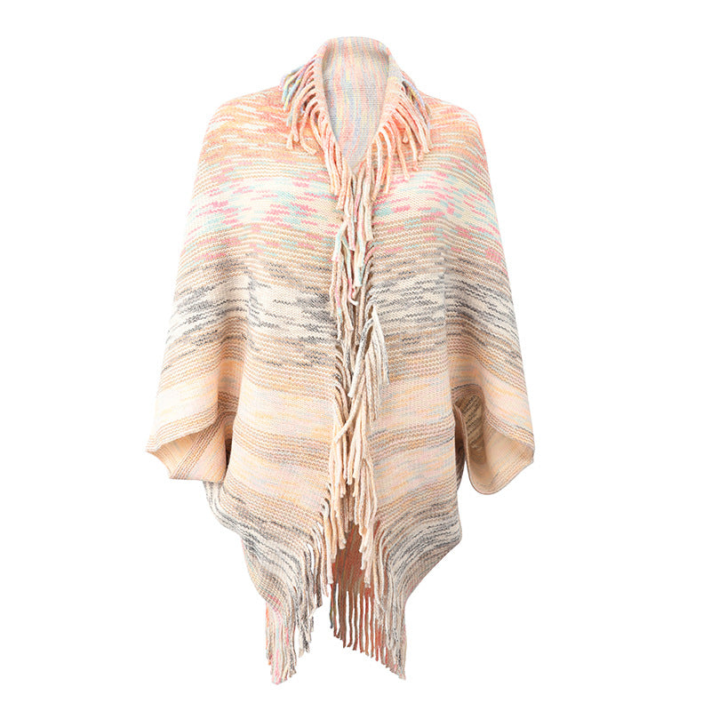 Ladies fashionable poncho with fringed hem and textured design