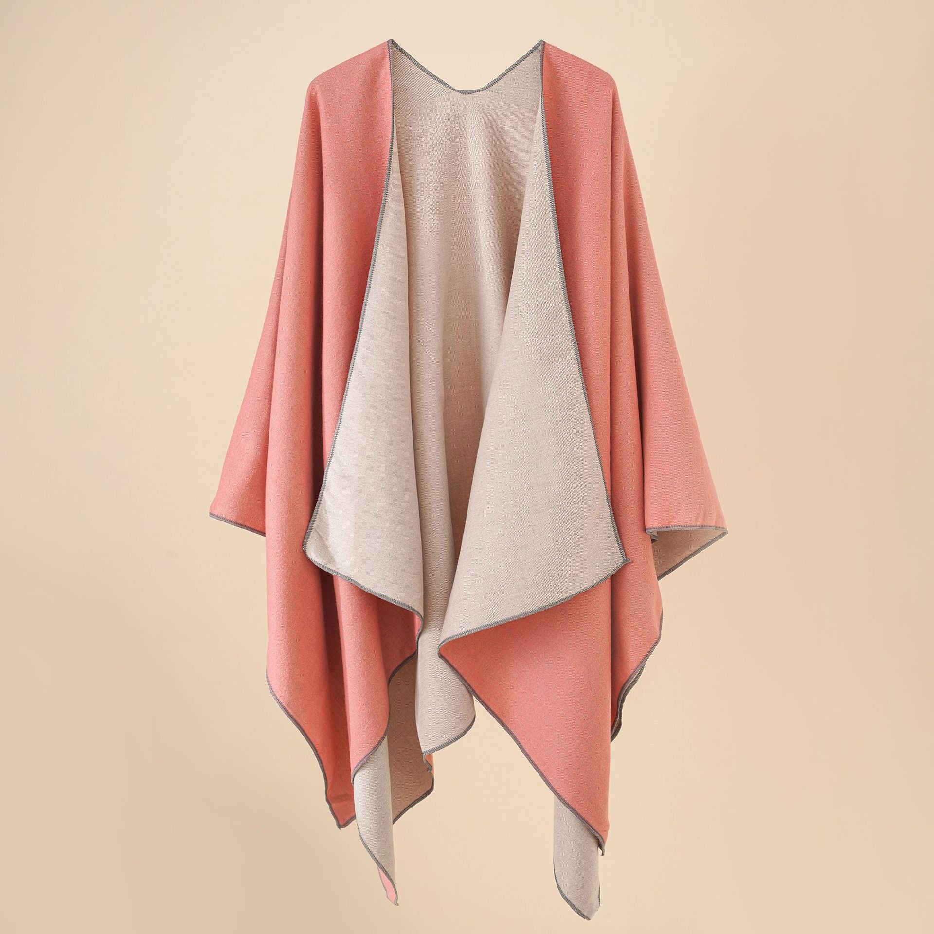 Women’s cozy poncho made of soft wool blend with elegant cut