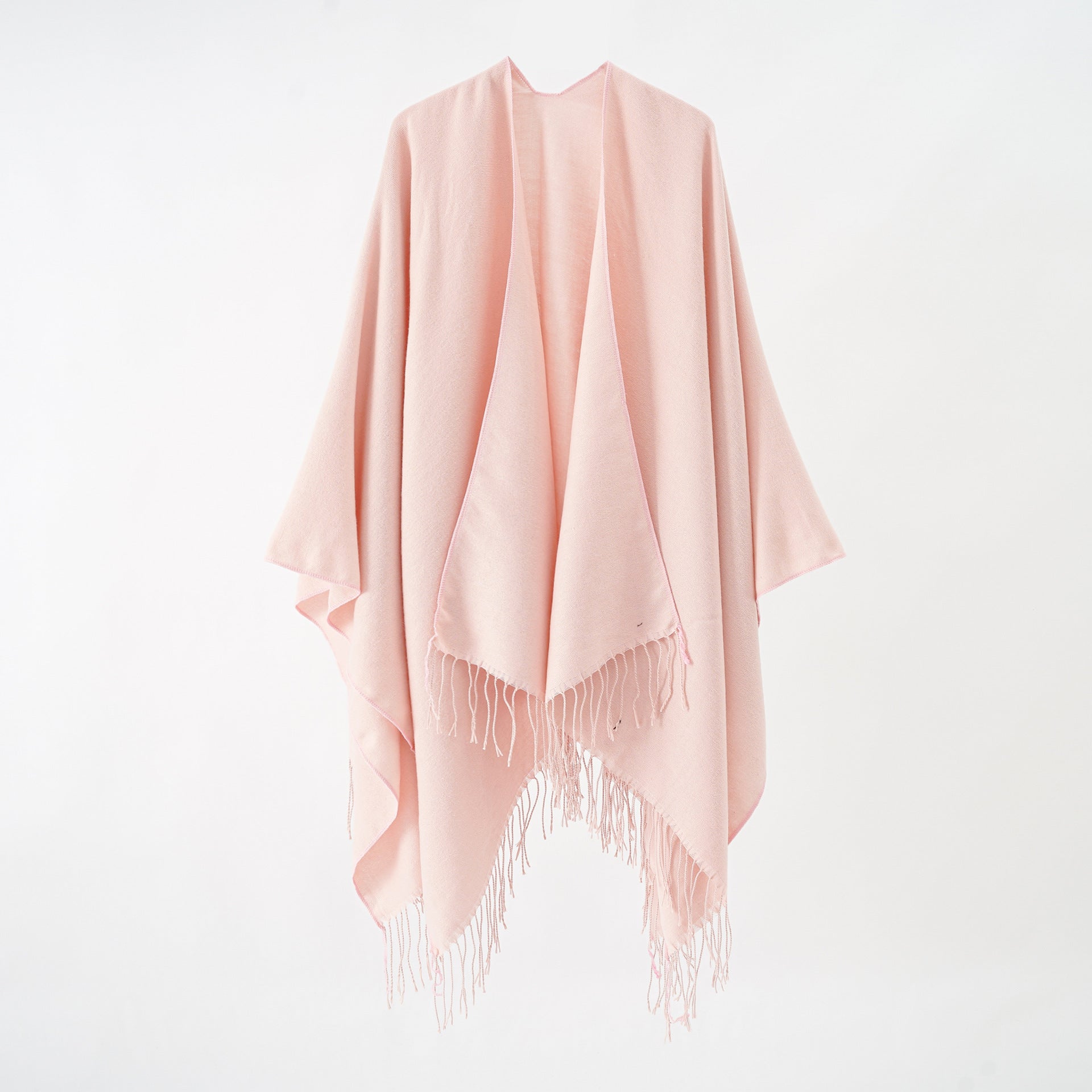 Women's stylish fringe poncho made from soft material with a luxurious drape