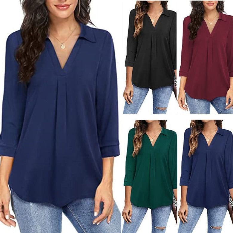 Women's blouse with modern V-neck and elegant pleats