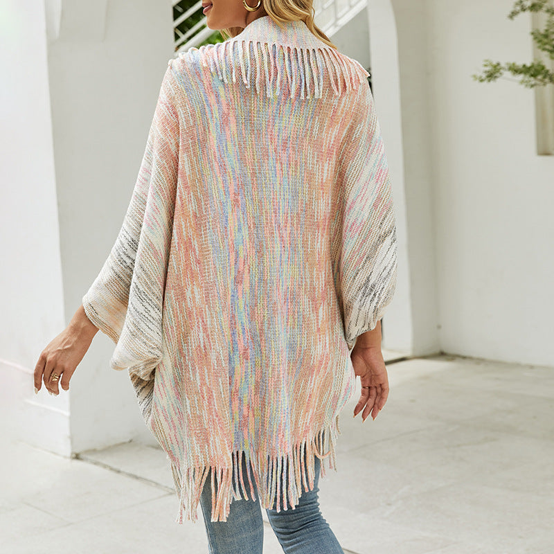 Ladies fashionable poncho with fringed hem and textured design