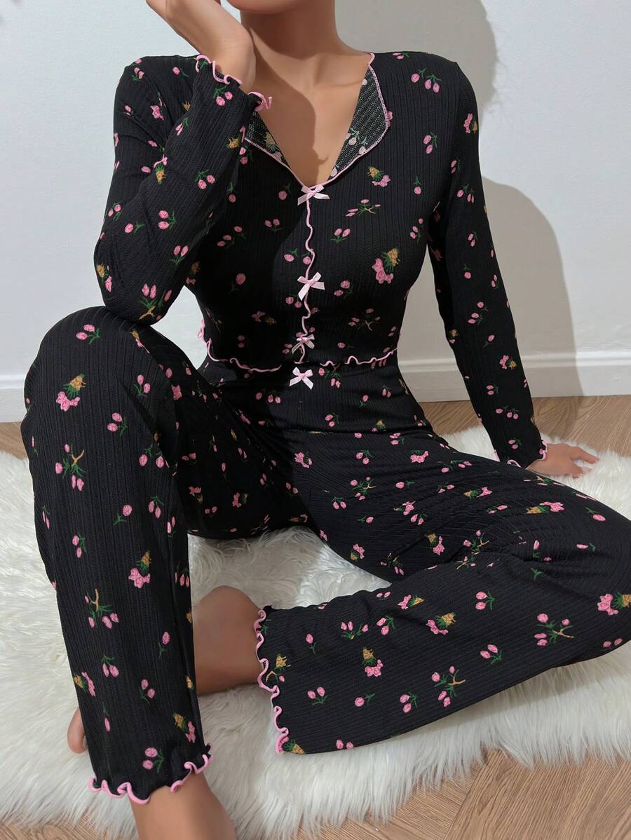 Women's pajama set with delicate ruffle and floral pattern