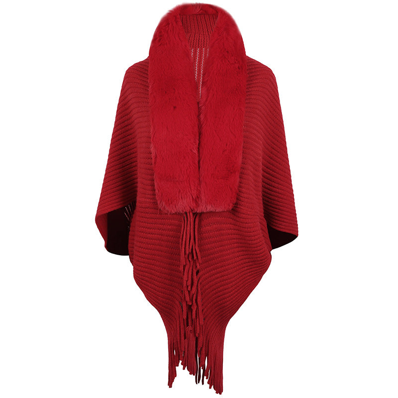 Women's luxurious knit poncho with elegant faux fur collar and fringes