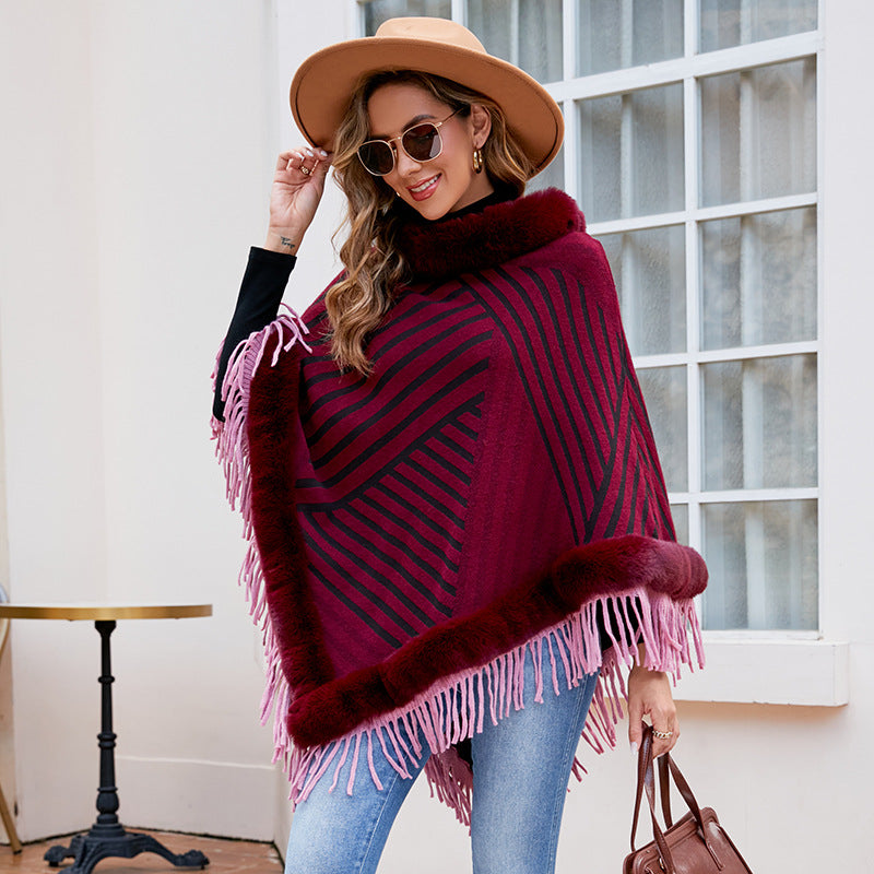 Ladies fashionable poncho with elegant fringe decoration