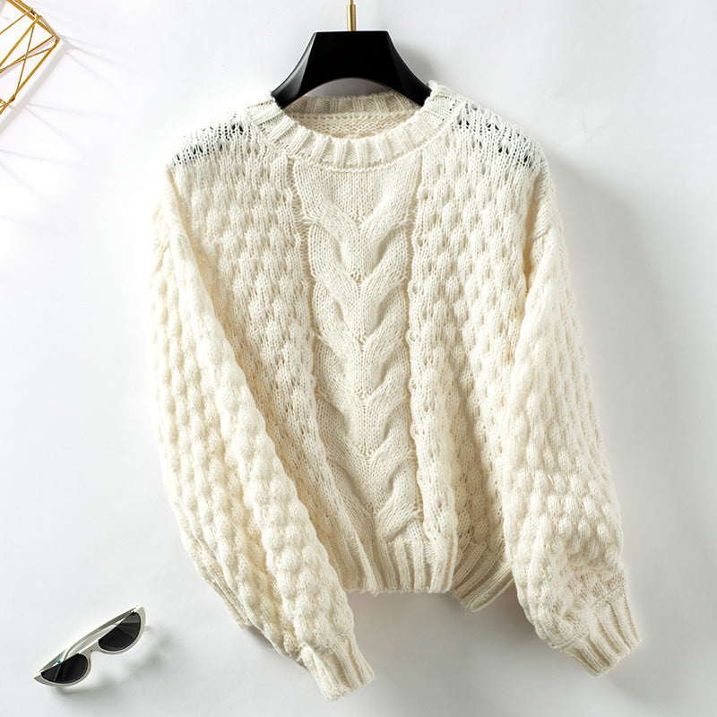 Women's cozy knit pullover with textured cable pattern and casual fit