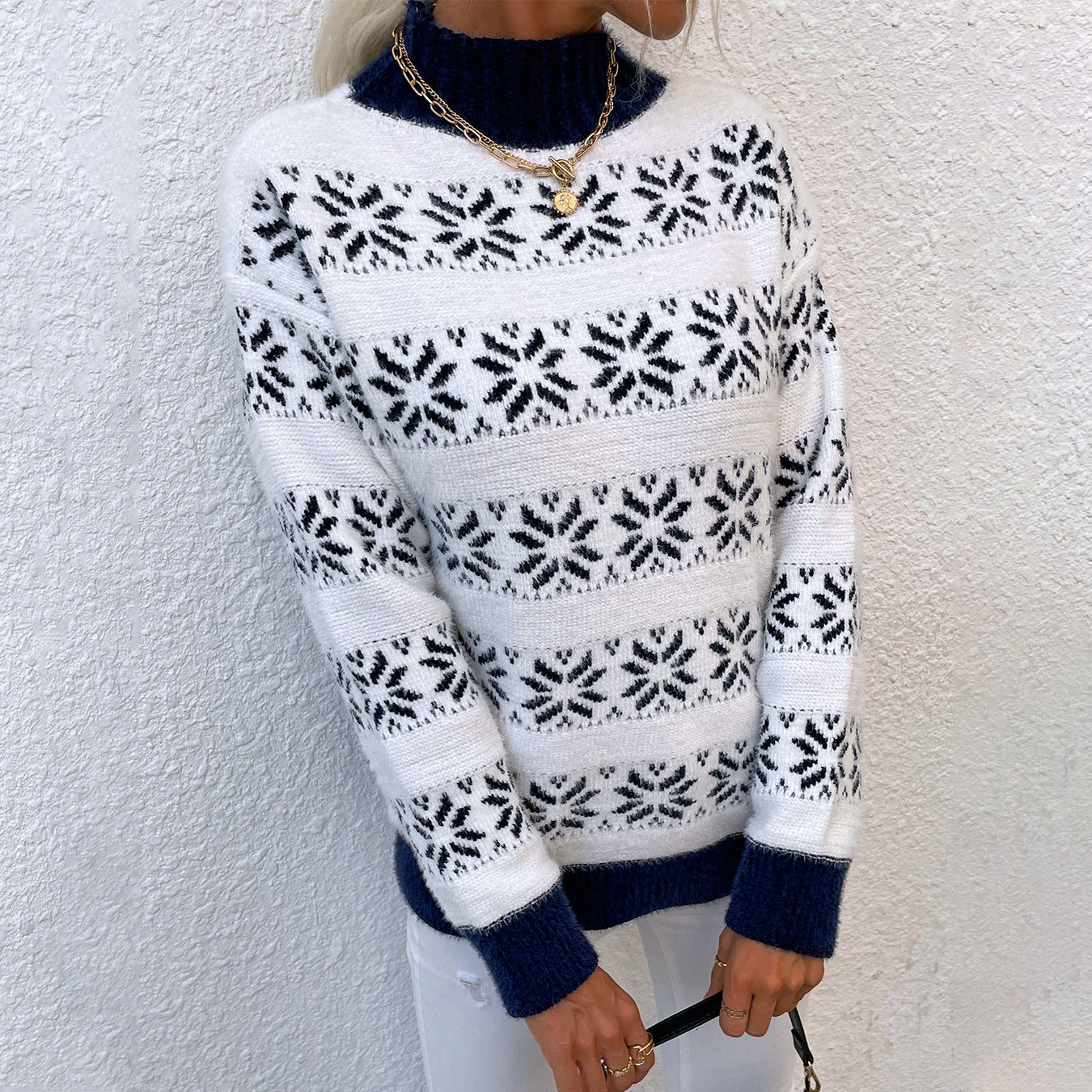 Women's knit pullover with winter motif and high neck collar