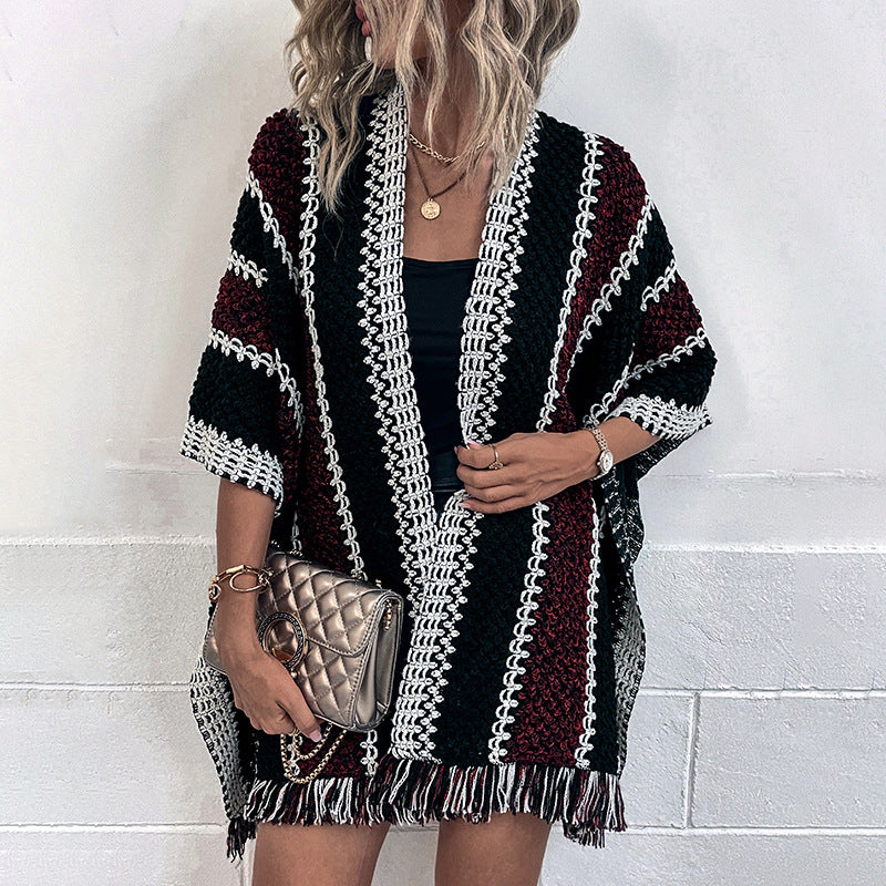 Women's knit poncho with V-neck and fringes