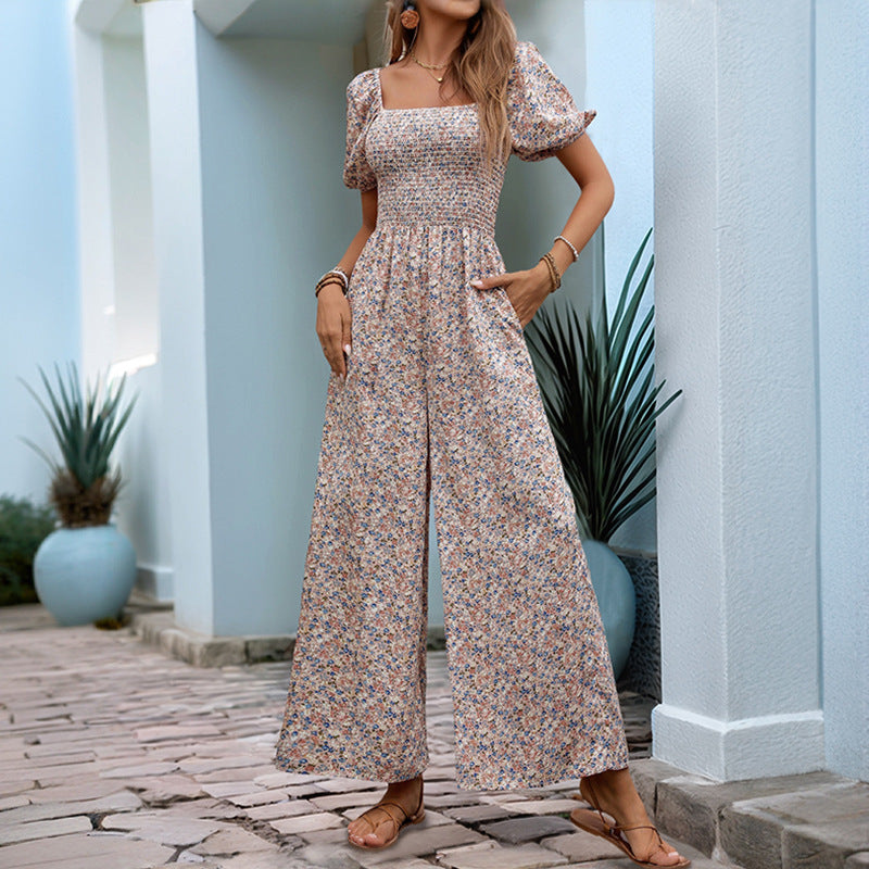 Women's floral patterned jumpsuit with puff sleeves and side pockets