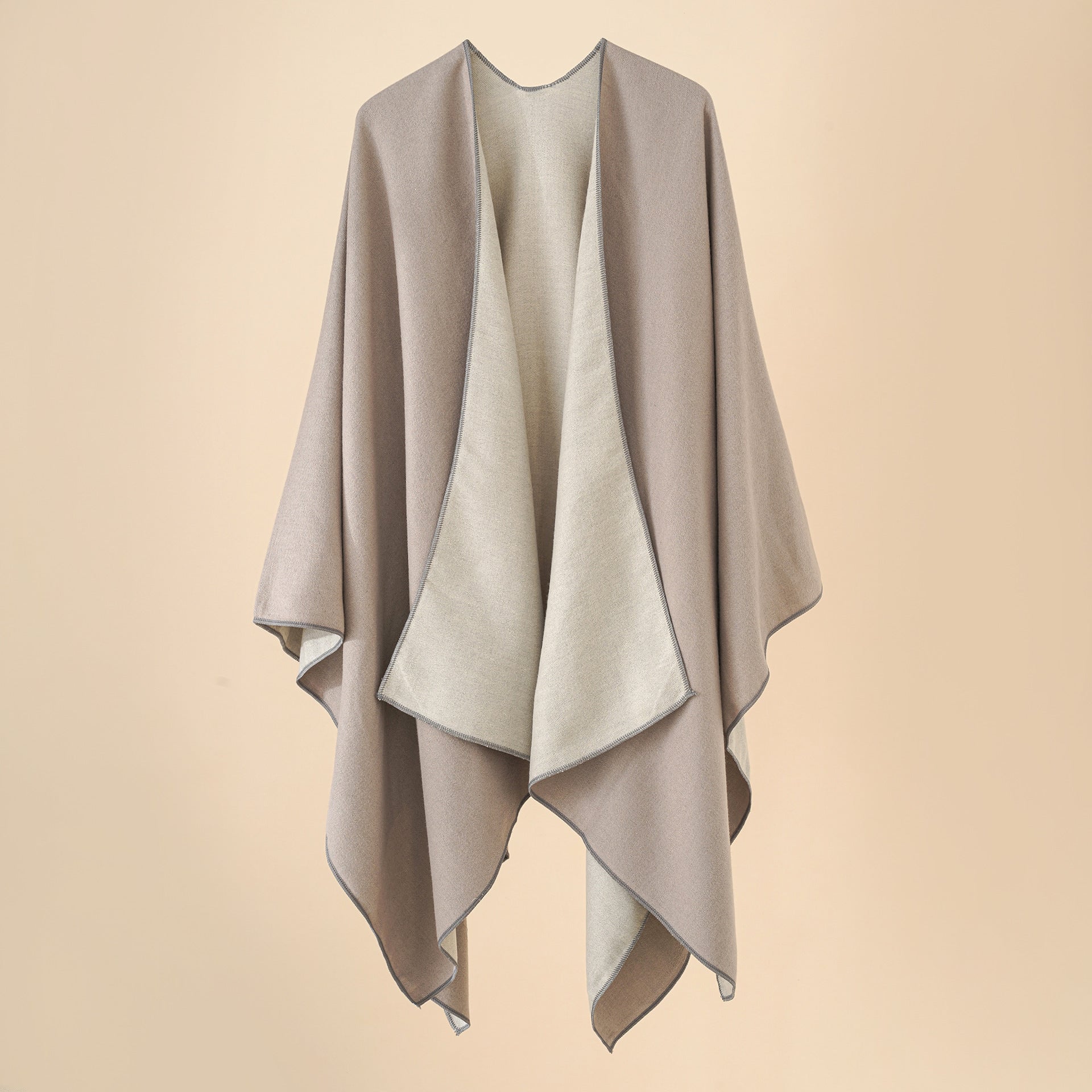Women’s cozy poncho made of soft wool blend with elegant cut