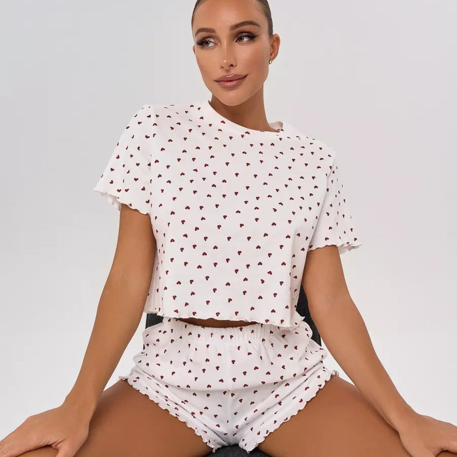 Women's pajamas set with playful heart design and decorative hem
