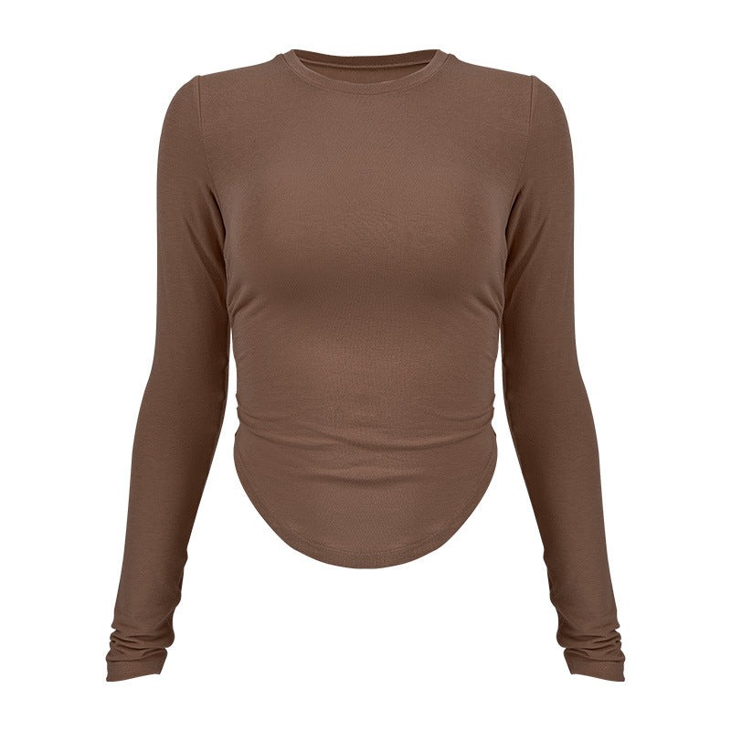 Ladies long-sleeved functional top with stylish gathering elements and figure-hugging cut