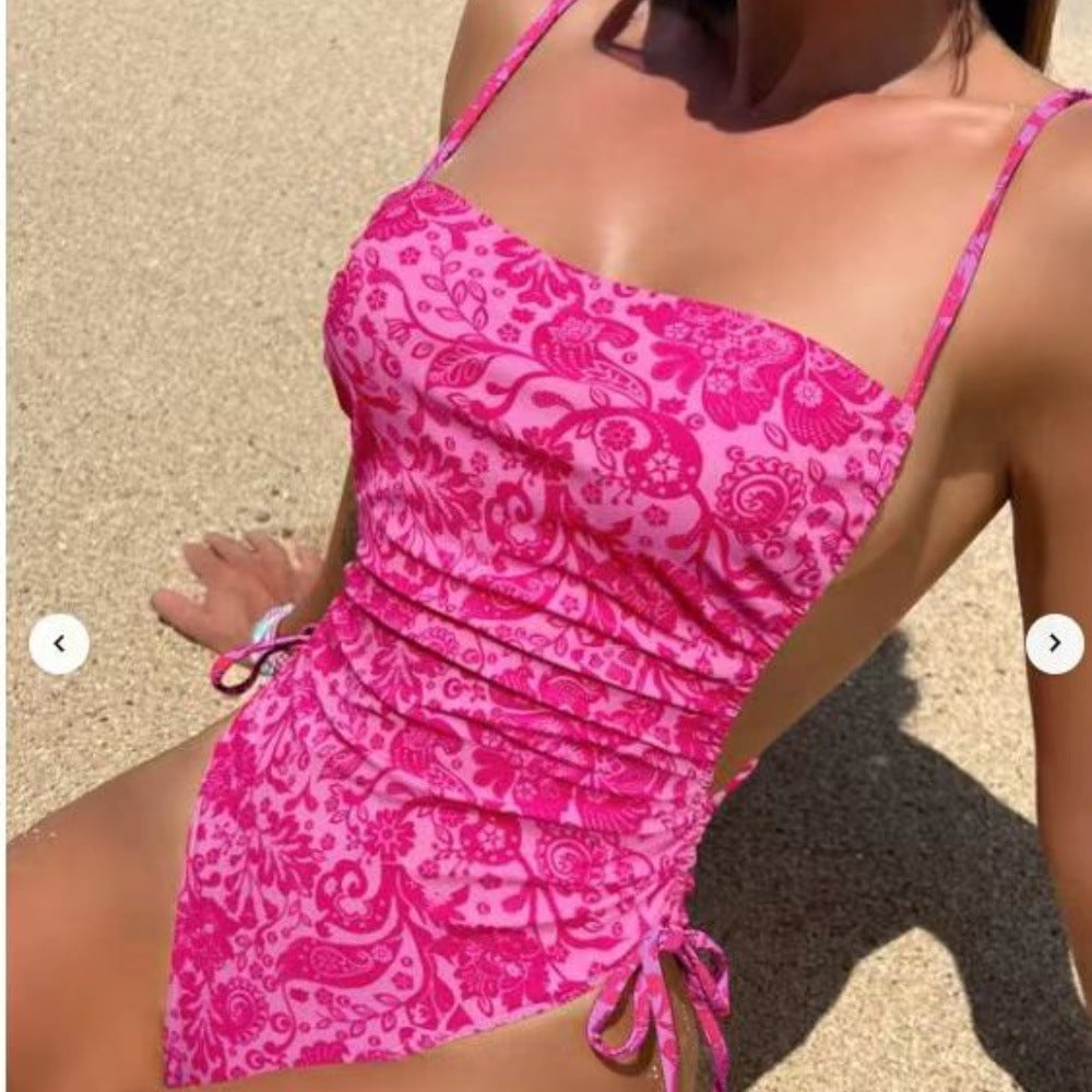 Women's one-piece swimsuit with playful floral design and adjustable cut